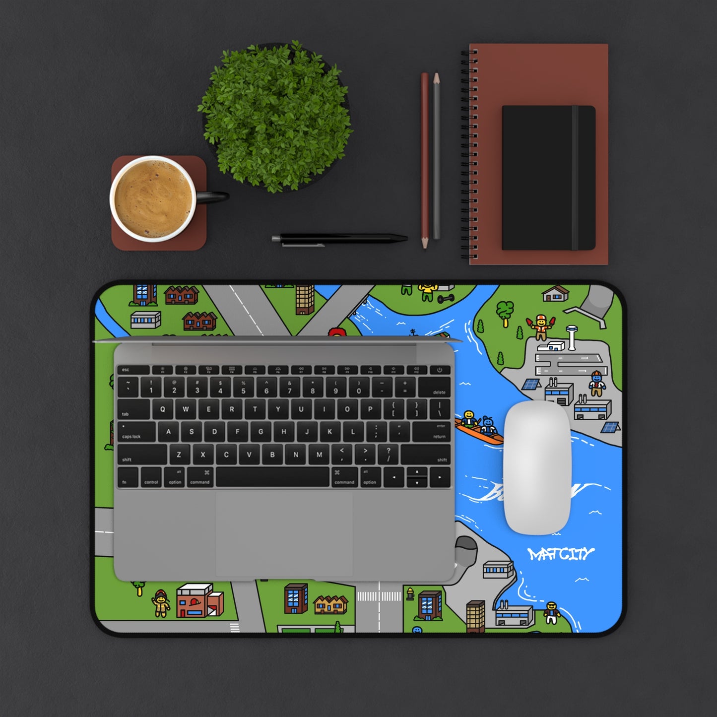 A desk setup with the Boston mouse mat beneath a laptop and mouse, highlighting the spacious surface area and vibrant map illustration.