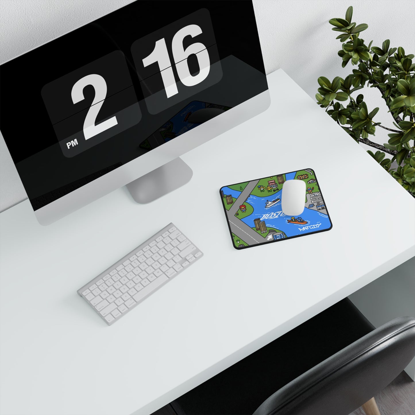 A small Boston-themed mouse mat on a white desk beside a keyboard and monitor, enhancing a clean and organized workspace.
