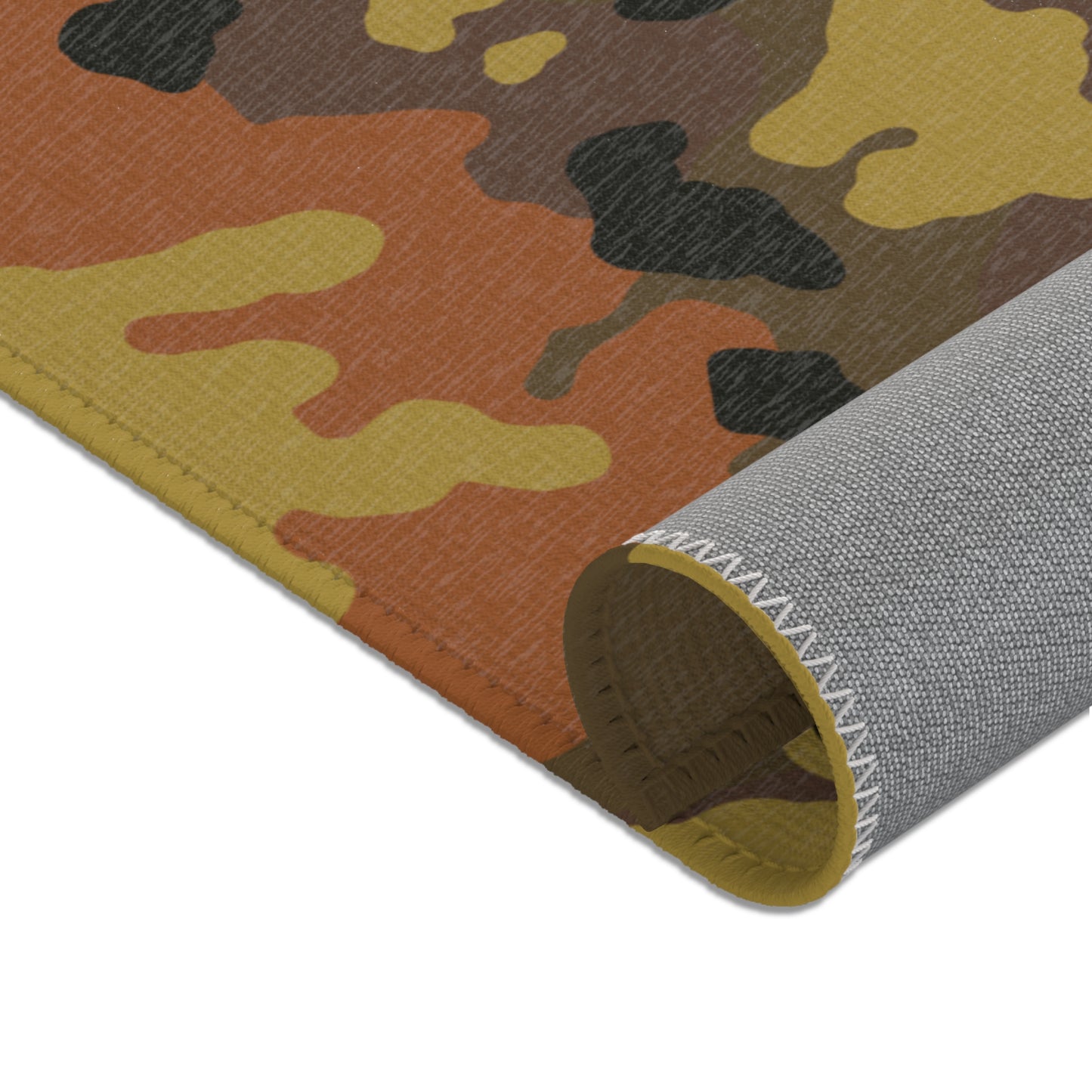 Fall camouflage patterned mat rolled showcasing the underside on a white background