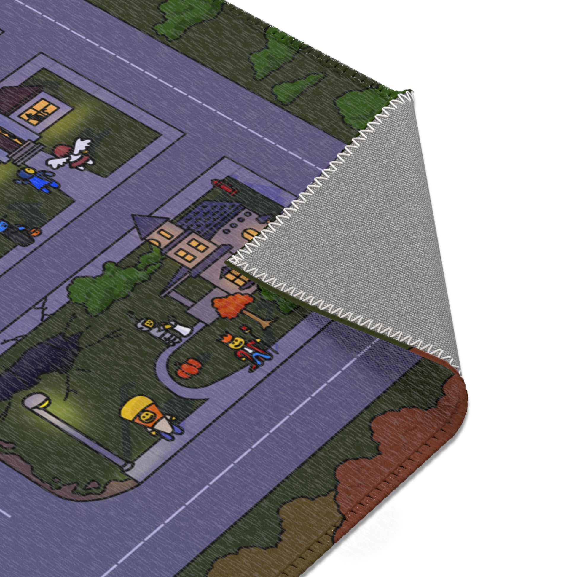 Close-up of the Matcity Halloween 2025 Mat showing detailed stitching and a peek at a costumed character under a glowing streetlight.