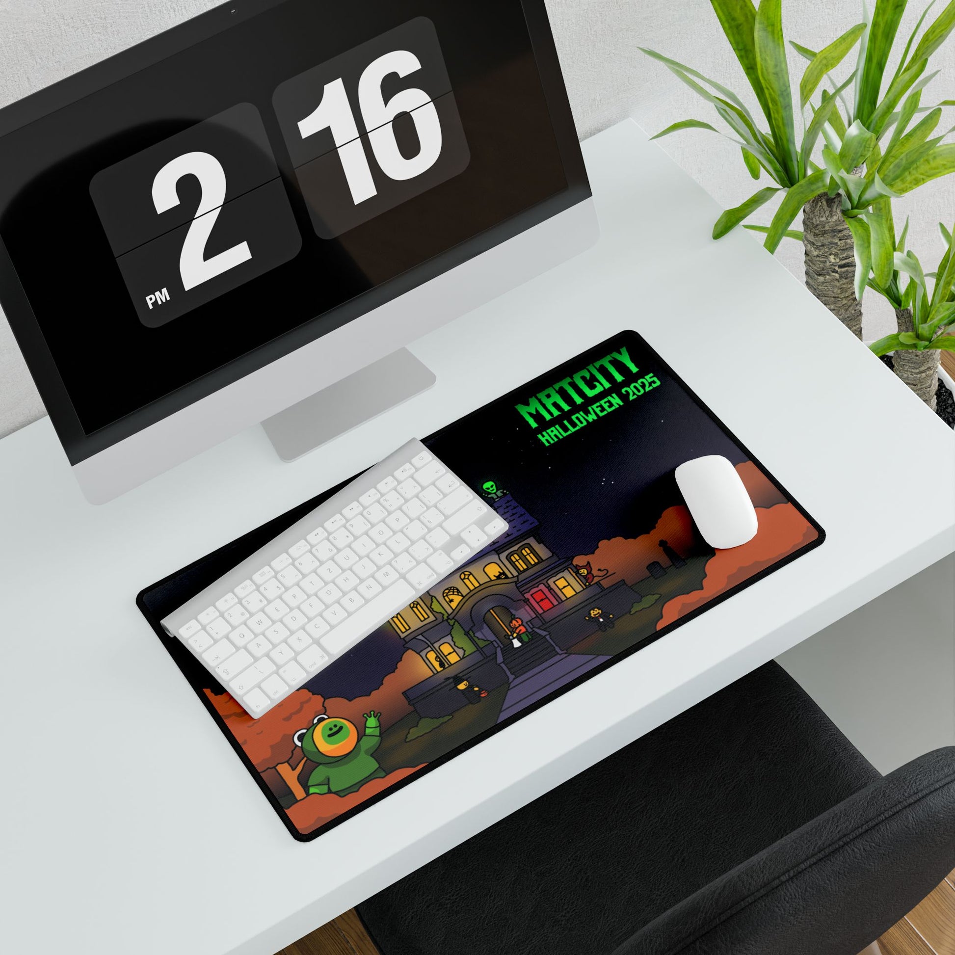 Medium Matcity Halloween 2025 Mouse Pad on a modern desk setup, showing a night scene with glowing orange trees.