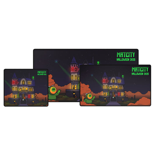 Three Matcity Halloween 2025 Mouse Pads in different sizes, each showing a glowing haunted mansion scene with orange trees and Halloween lights.