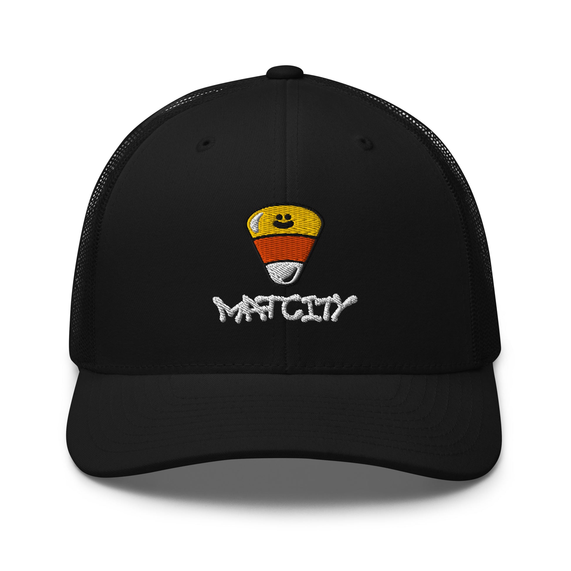 A black trucker cap with mesh back featuring an embroidered candy corn and white Matcity graffiti logo on the front, with a curved brim.