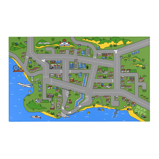 A playful overhead view of the Matcity Los Angeles mat, featuring cartoon-style streets, homes, LAX, Hollywood sign, and a lively beachside scene.