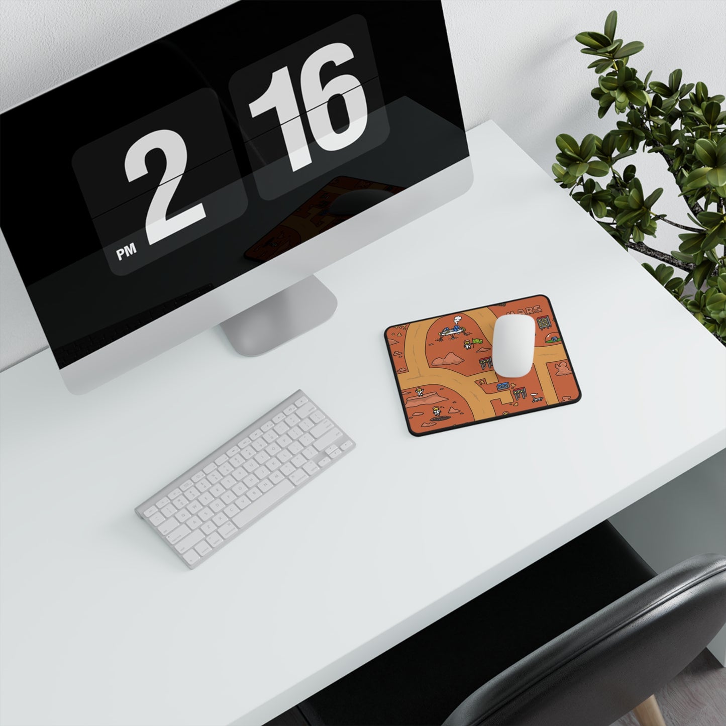 A top-down view of a desk with a computer and accessories, with the Matcity Mars Mouse Mat Small prominently displayed under the mouse, bringing a fun, Martian landscape to the scene.