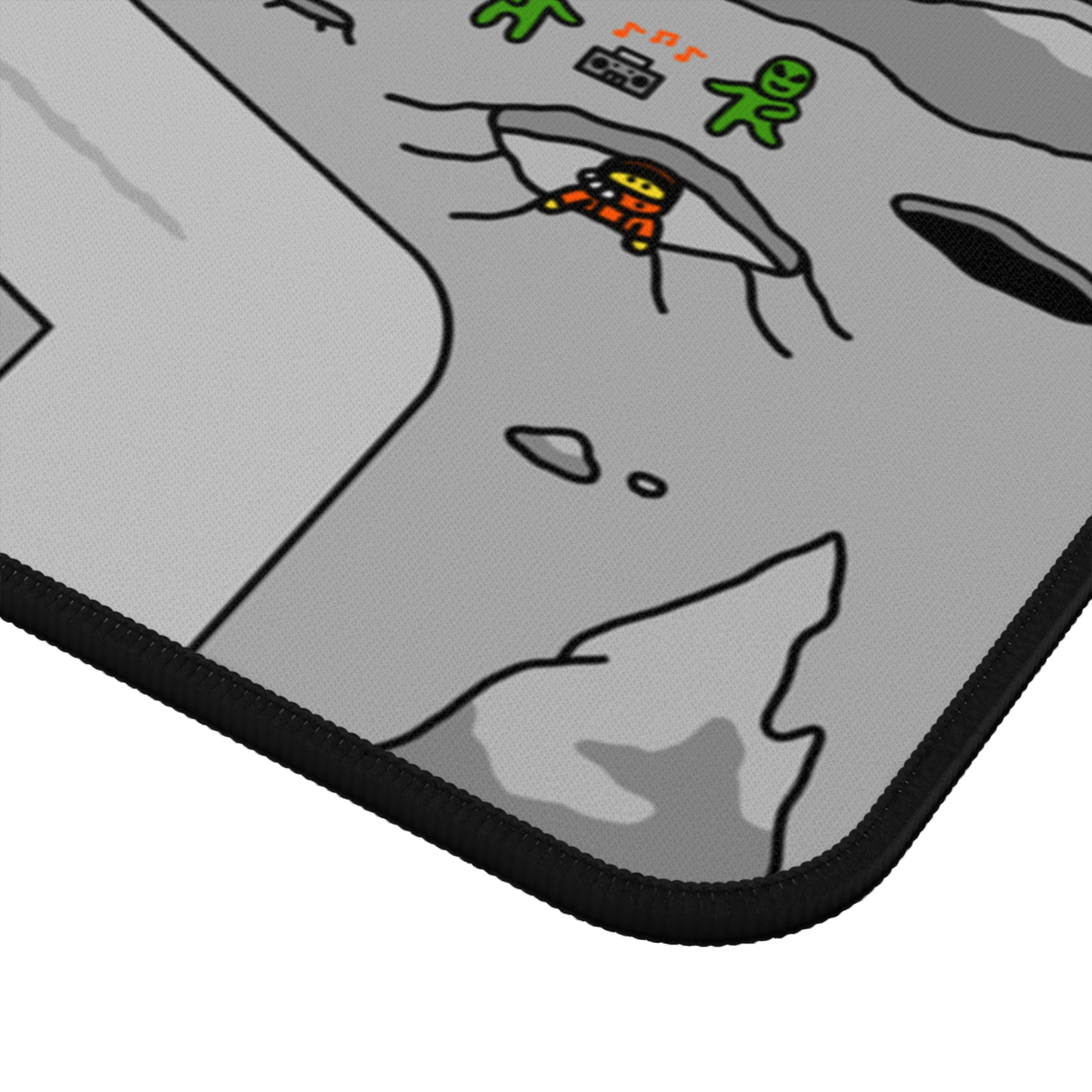 Close-up view of the Matcity Moon Mat Large corner, showing intricate stitching and a part of the cratered lunar surface with an astronaut and a green alien.