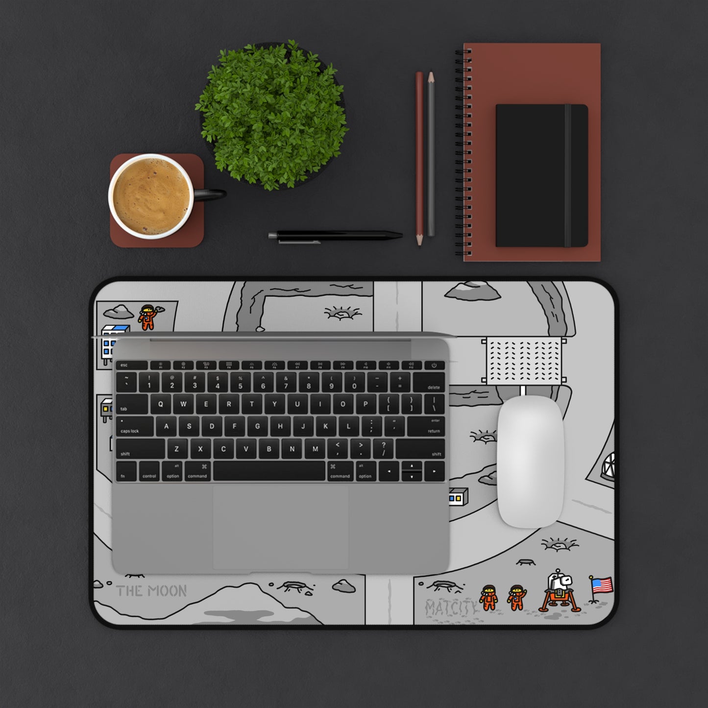 Matcity Moon Mouse Mat Medium with a laptop and mouse placed on top. The mat’s design includes futuristic lunar structures, space vehicles, and astronauts, enhancing a space exploration theme.
