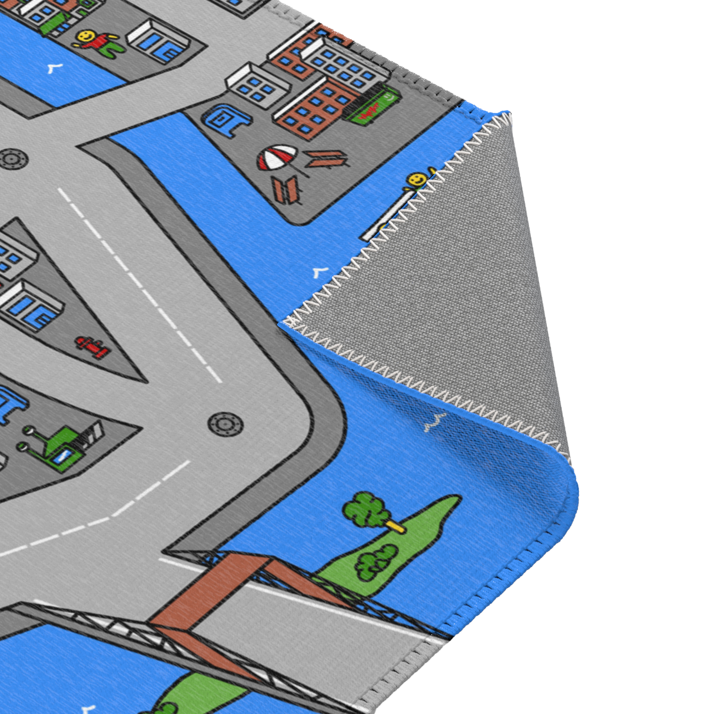 A folded corner of the Matcity New York Mat, revealing neatly stitched edges and a playful river scene with boats and city buildings along the water.