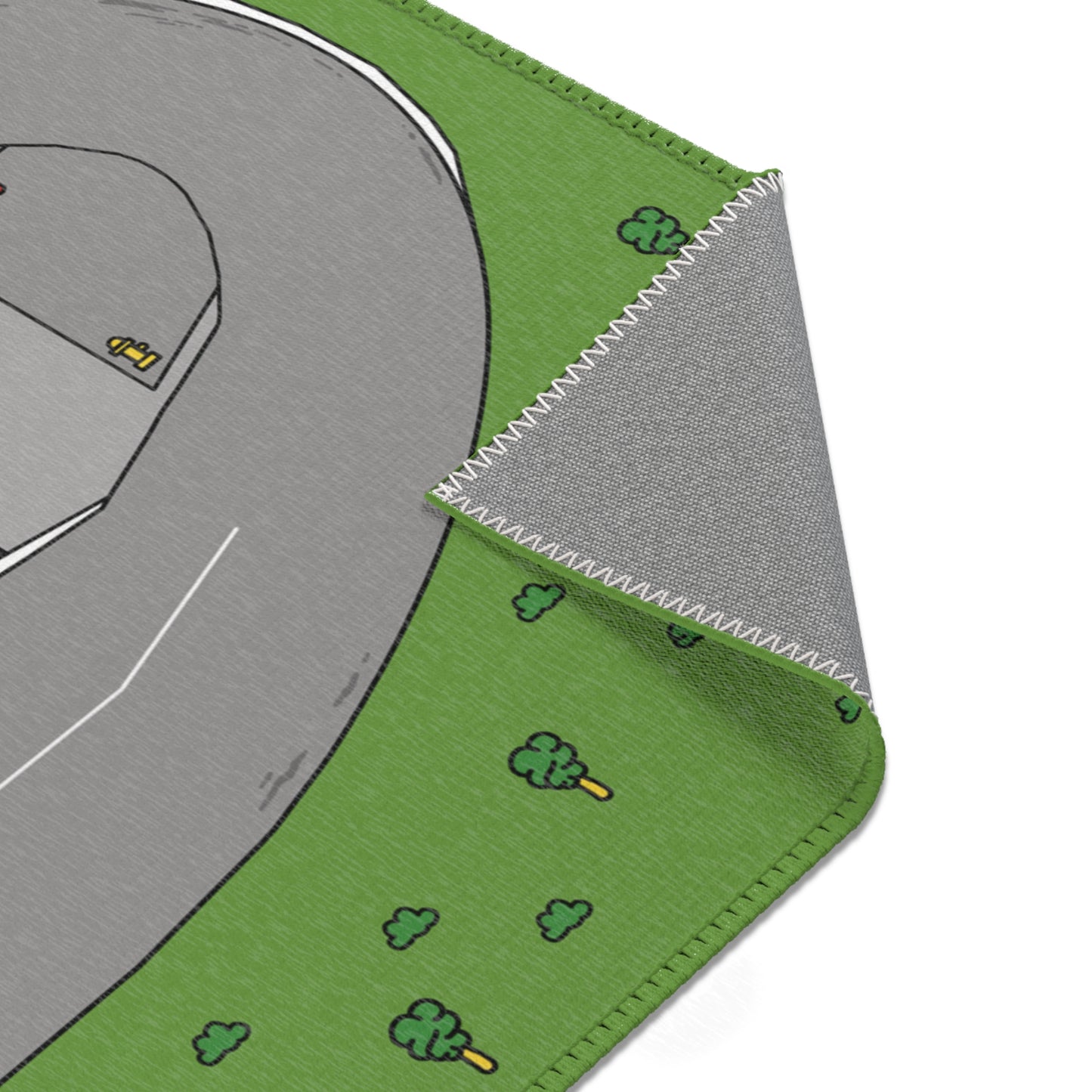 A close-up of the folded corner of the Matcity Raceway Mat, highlighting the durable stitching and non-slip base.