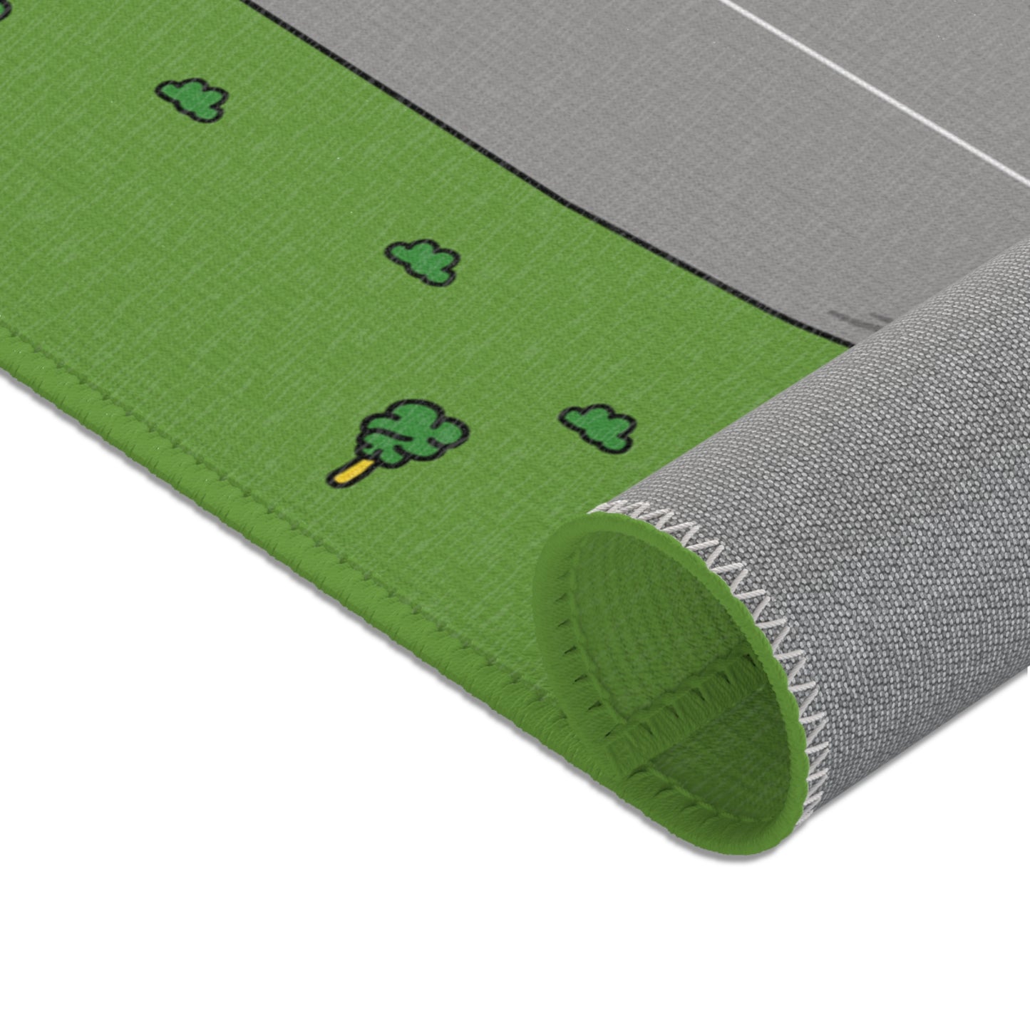 The Matcity Raceway Mat rolled up, showing the flexible material and neatly stitched edges, ready for easy storage.
