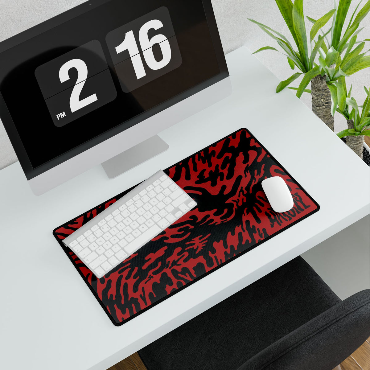 Desk setup with a large Red Tieger camouflage patterned mouse pad medium, computer monitor, keyboard, and mouse.