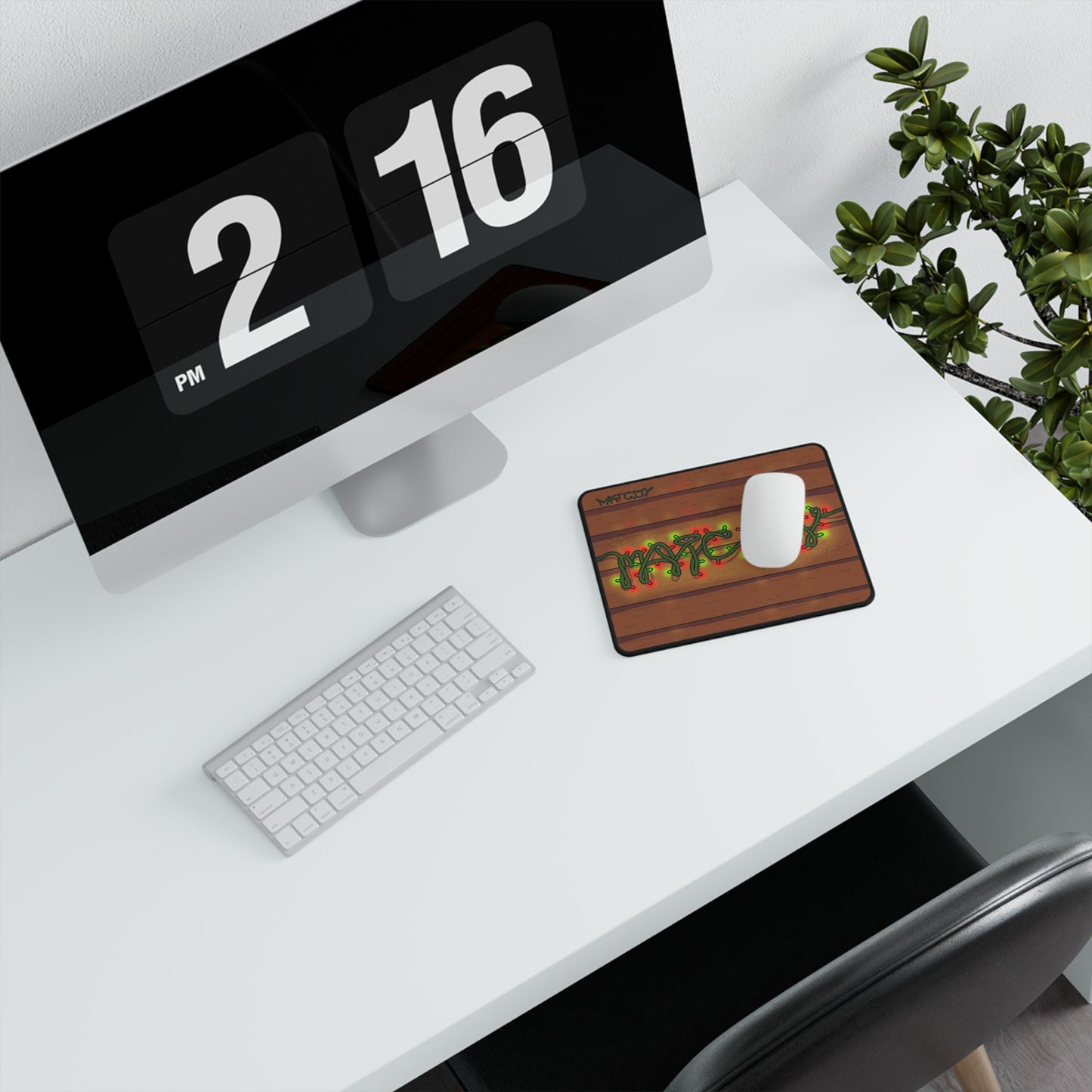 The mouse pad is displayed on a white desk setup with a modern iMac, keyboard, and mouse, creating a cozy holiday aesthetic.