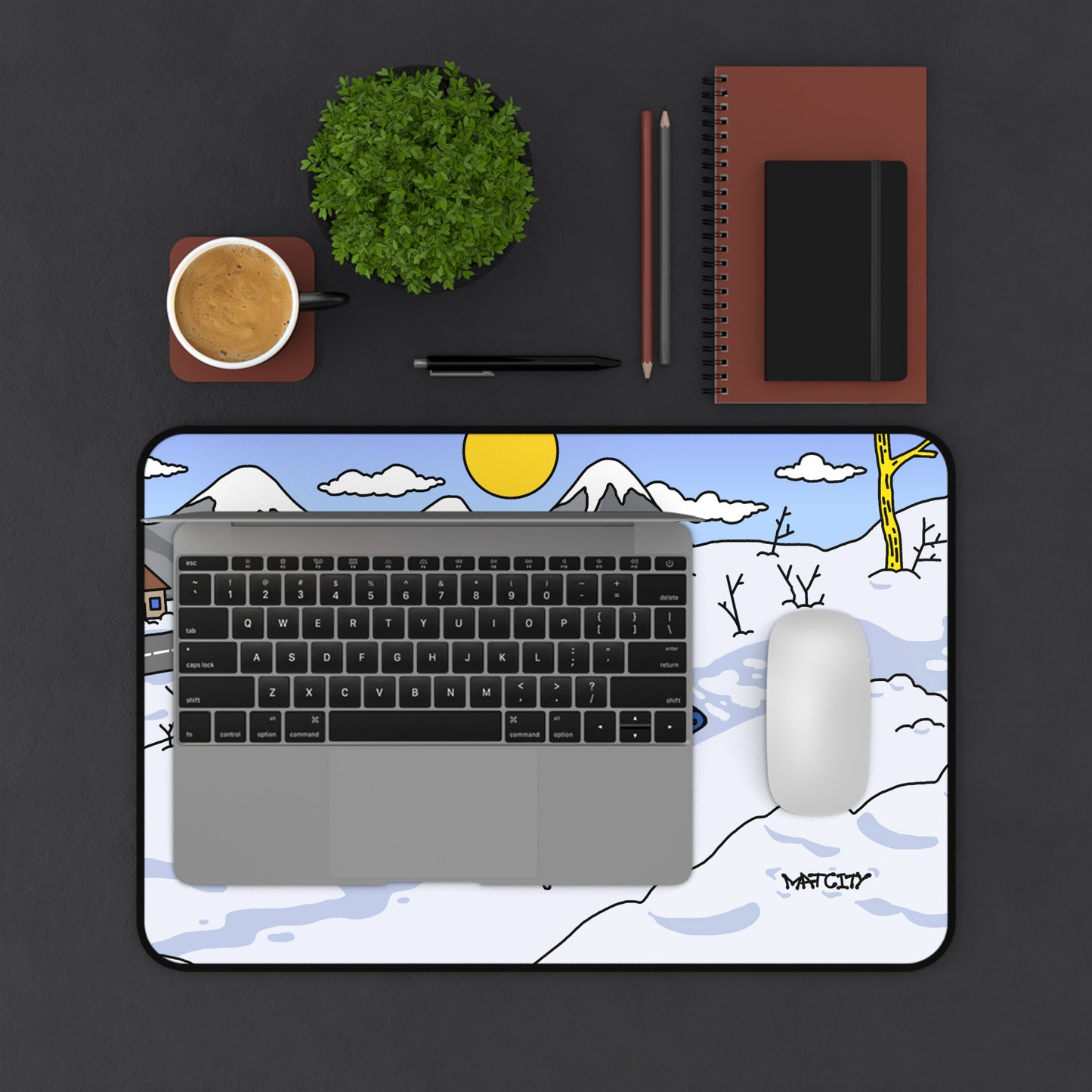 Overhead view of the Matcity Snow Rally Mousepad with a laptop and mouse on it, showcasing its medium size and design.