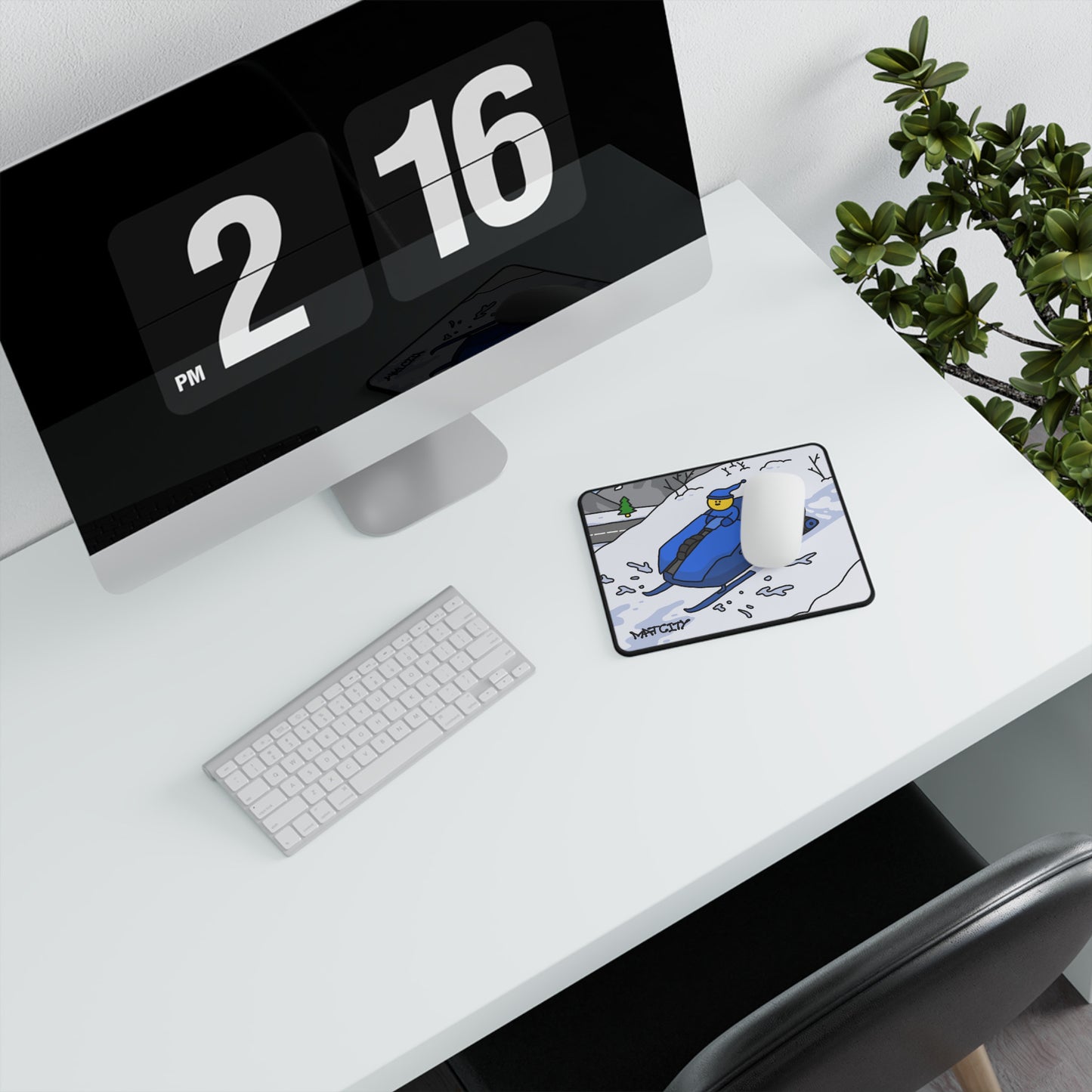 Matcity Snow Rally Mousepad Small on a white desk with an iMac, a plant, and a keyboard.