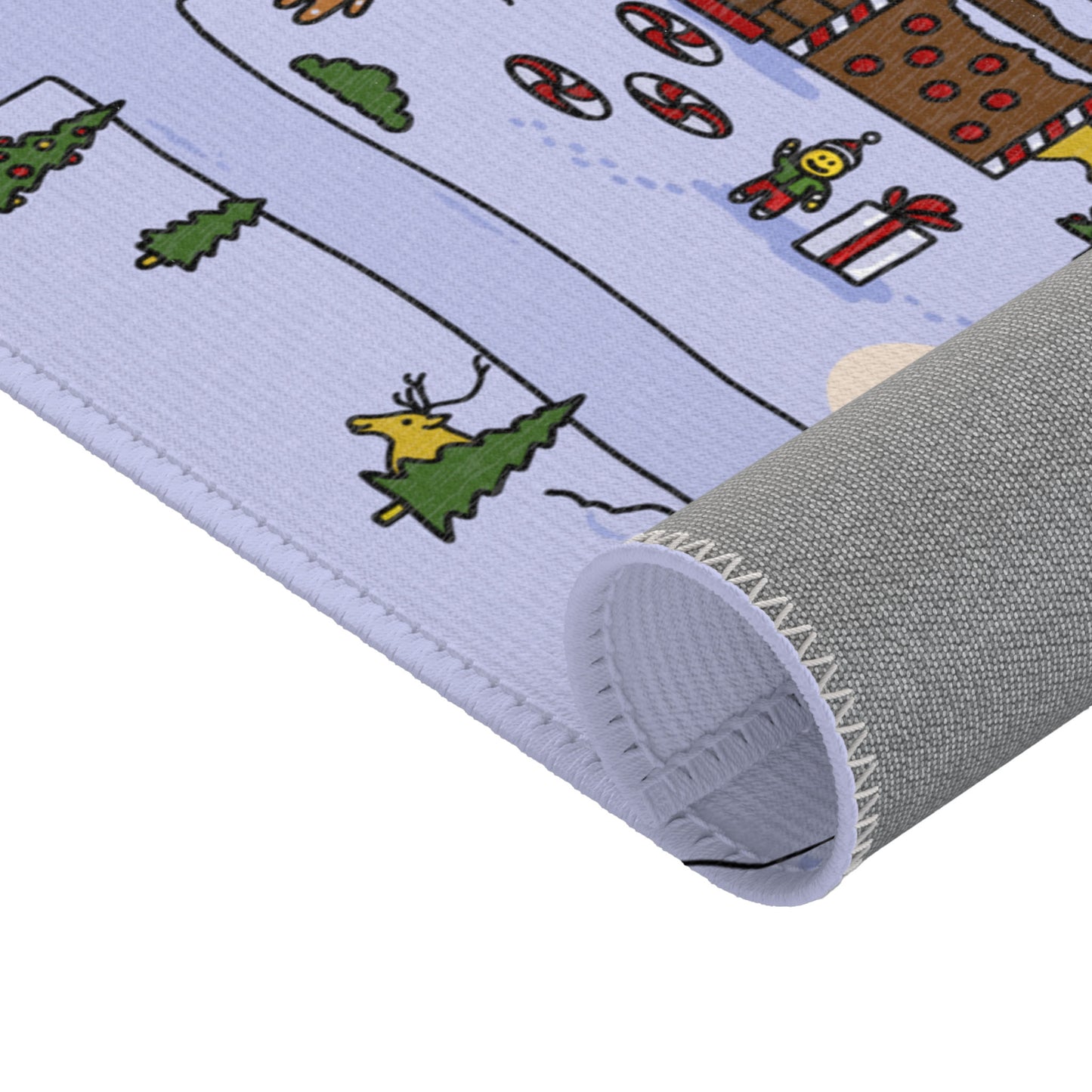 A side view of the rolled Santa's Village Mat, highlighting its portability and the vibrant winter-themed design visible even when compacted.
