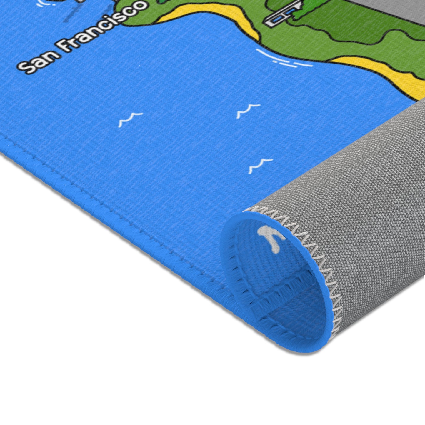 Rolled view of the Matcity California Mat highlighting the blue ocean edge, white stitching, and soft textured underside.