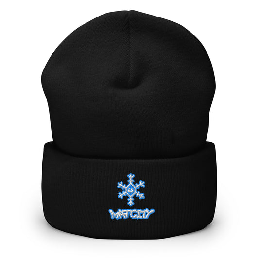 Black cuffed beanie displayed upright, cuff features blue embroidered snowflake over Matcity graffiti logo.
