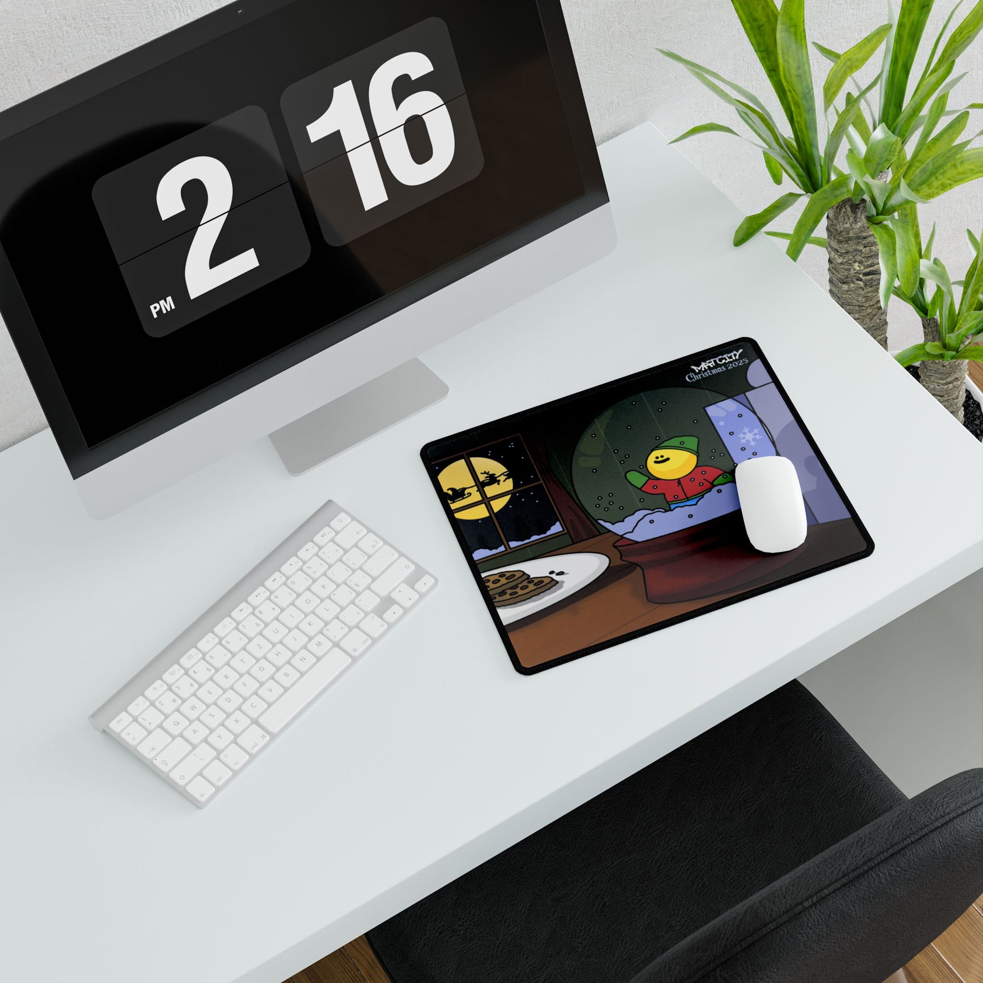 Compact pad beside mouse highlights the snow globe elf and cookie plate against a midnight blue window scene.