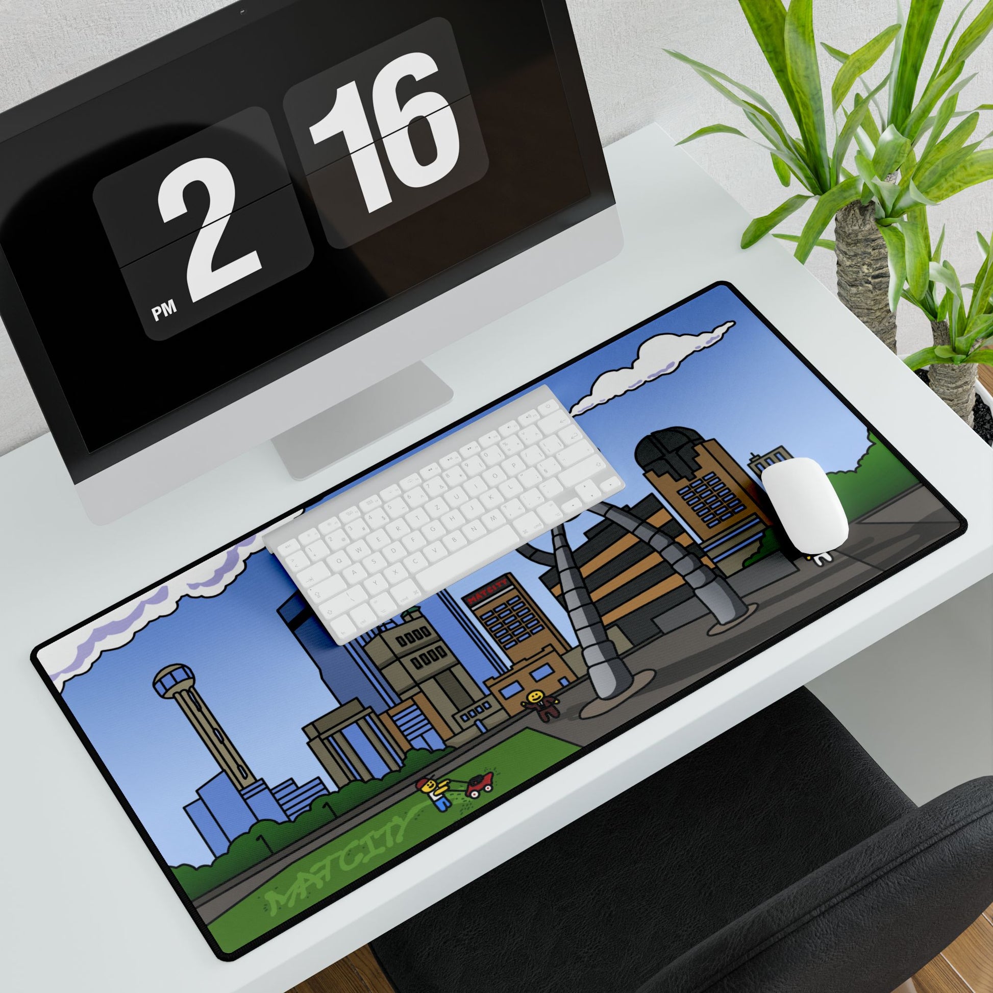 Extra-long pad under keyboard and mouse spans the width of a white desk, displaying the full city scene edge to edge.