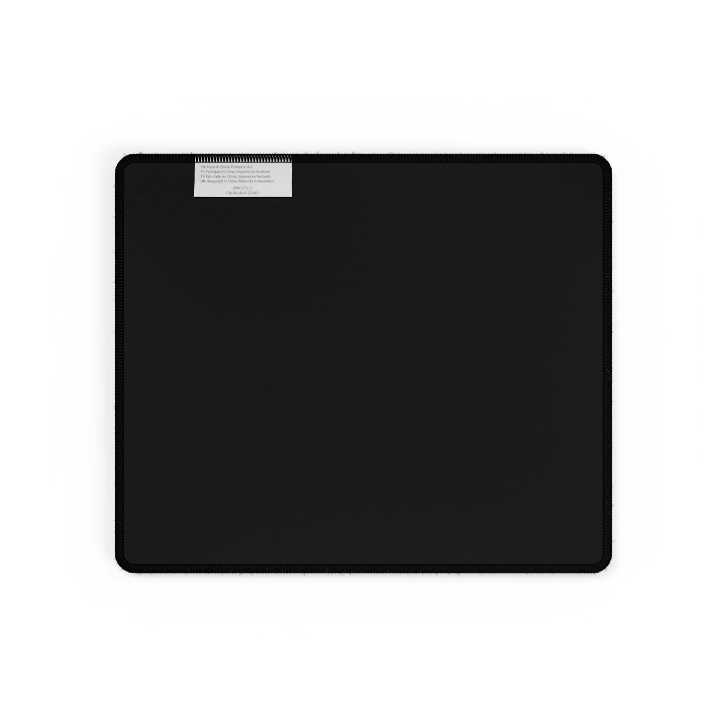 Small mat underside: black non-slip rubber surface with fabric care tag near the top edge.