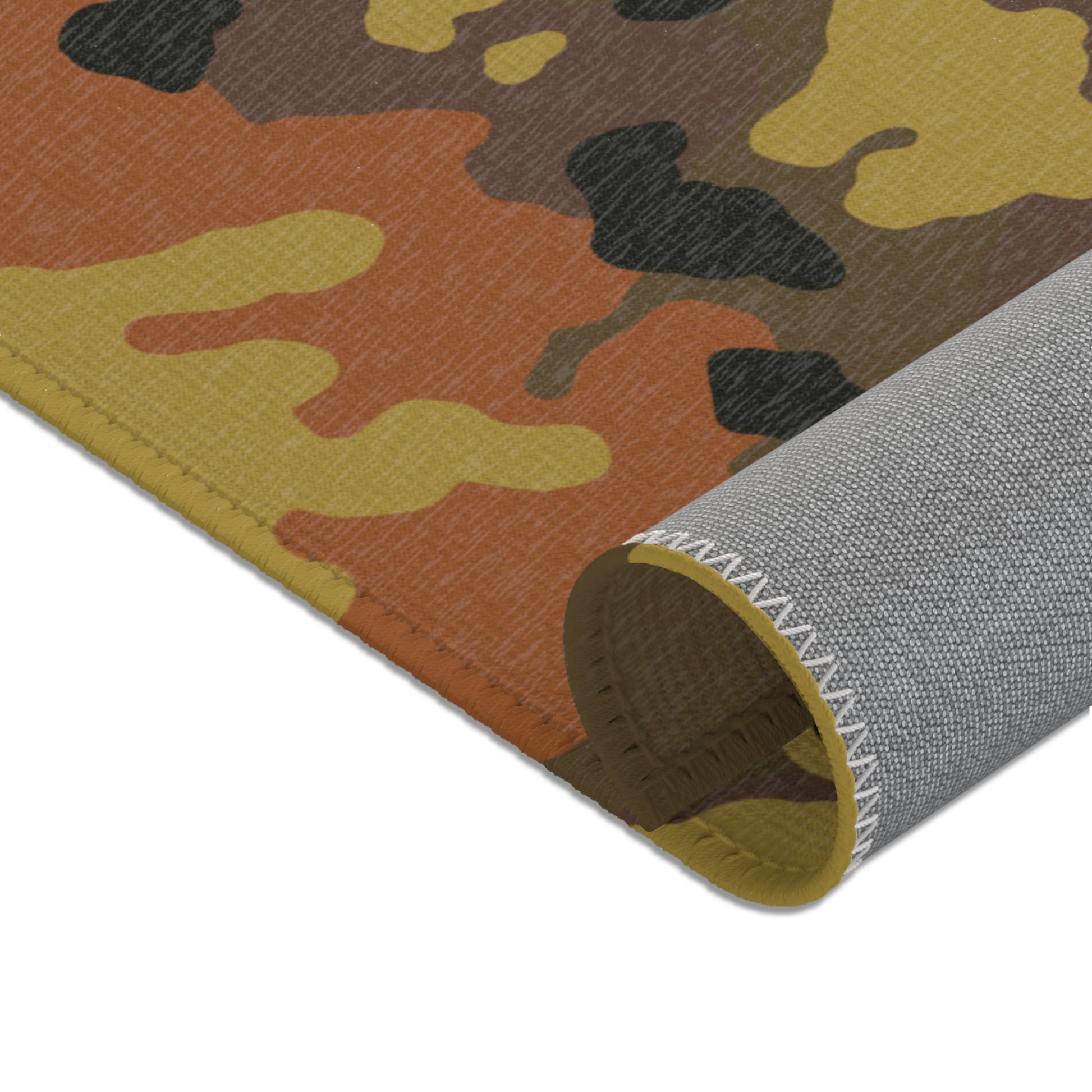 Fall camouflage patterned mat rolled showcasing the underside on a white background