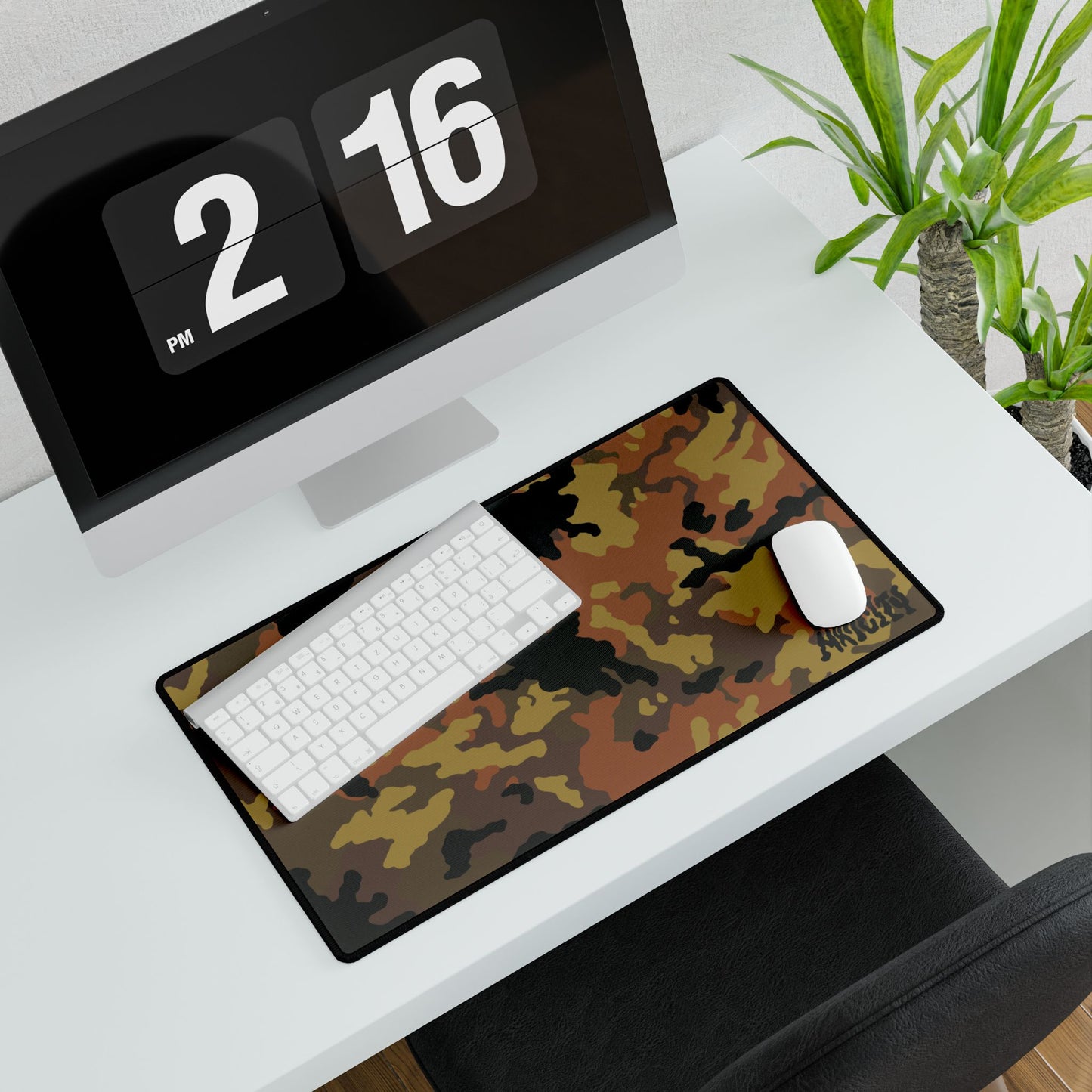 Fall Camouflage desk mat medium on a white desk with a computer setup.