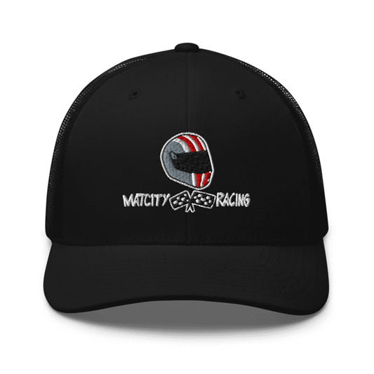 A black trucker cap with the Matcity Raceway helmet logo embroidered on the front, featuring red and white stripe details.