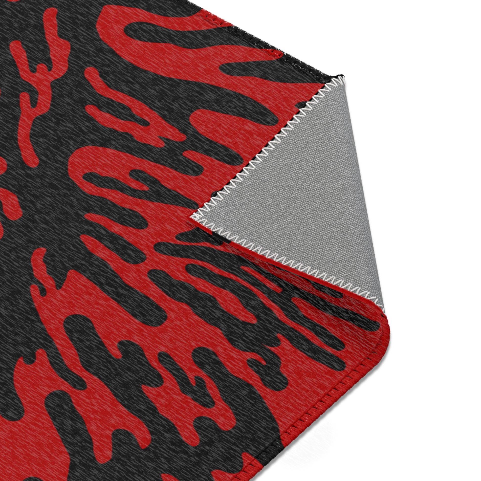 Red Tieger camouflage patterned mat folded showcasing the underside on a white background
