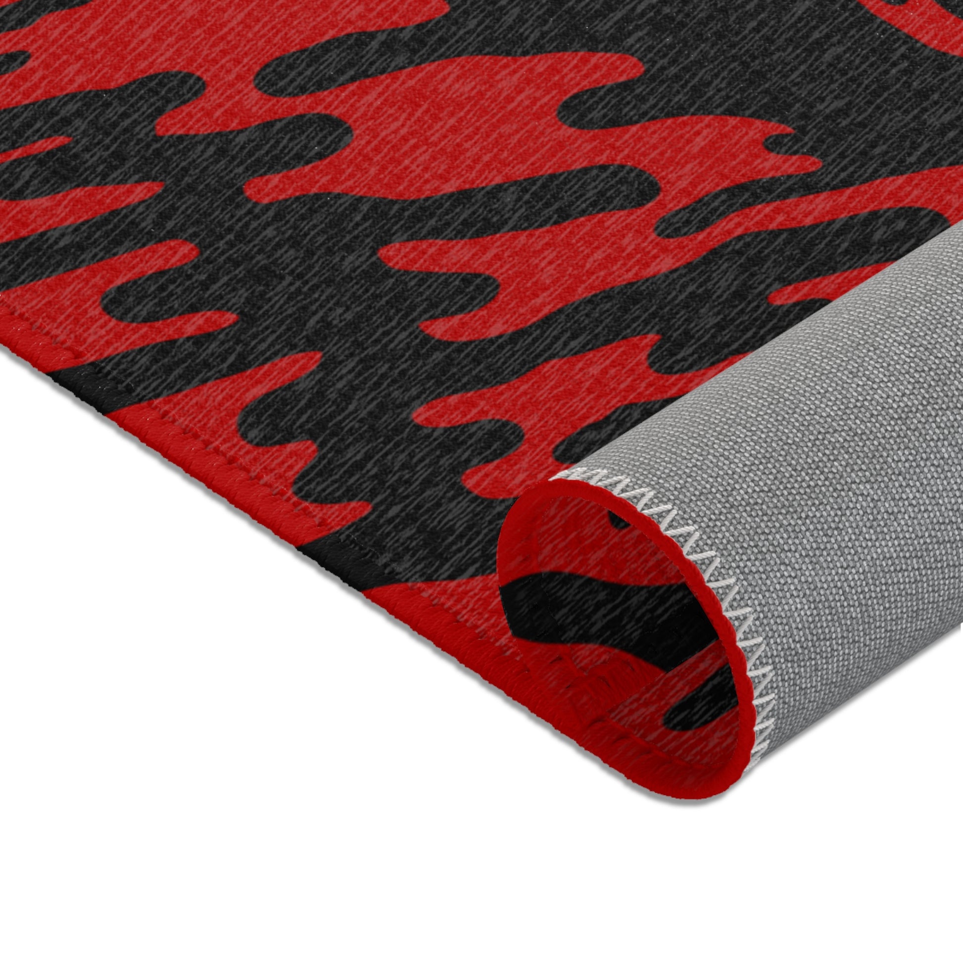 Red Tieger camouflage patterned mat rolled showcasing the underside on a white background