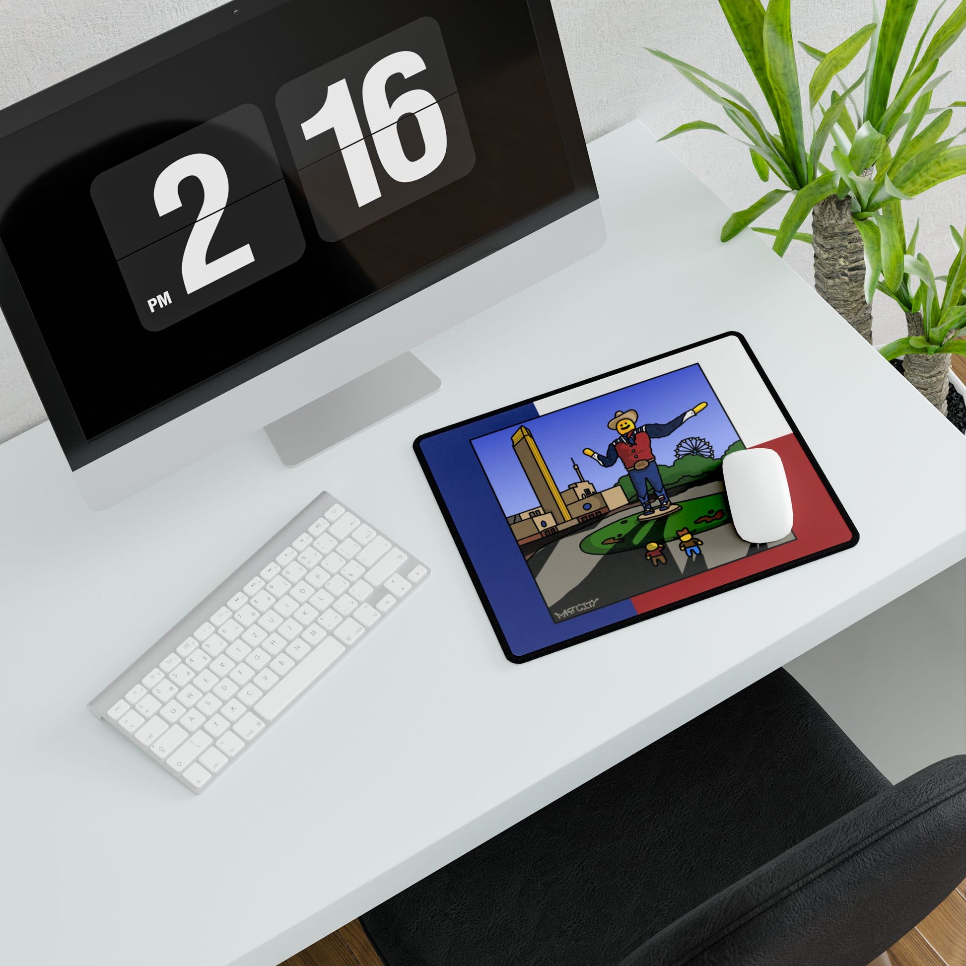 Small pad beside keyboard and mouse, showing Big Tex panel on flag tricolor.