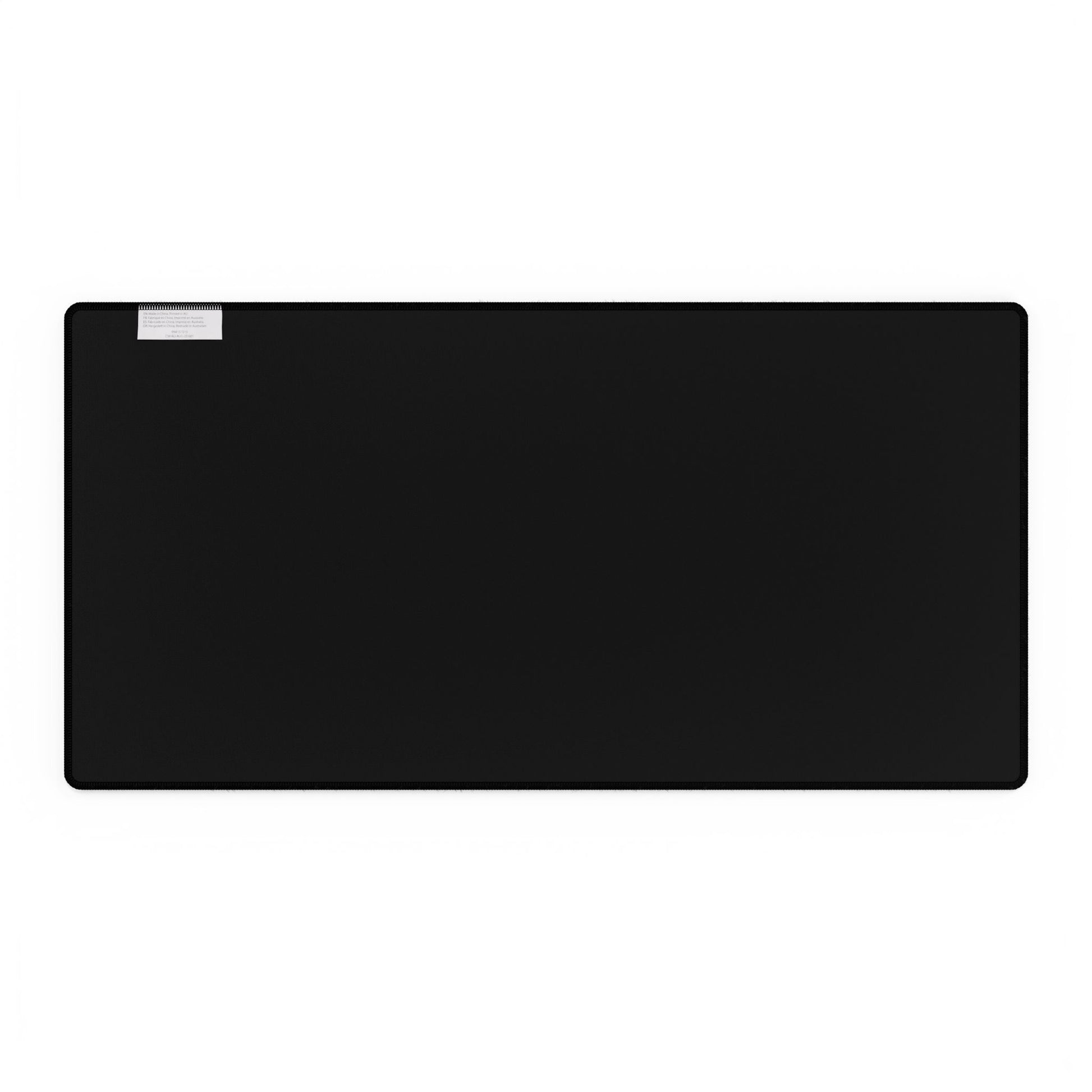 Black rectangular back side of a mouse pad on a white background