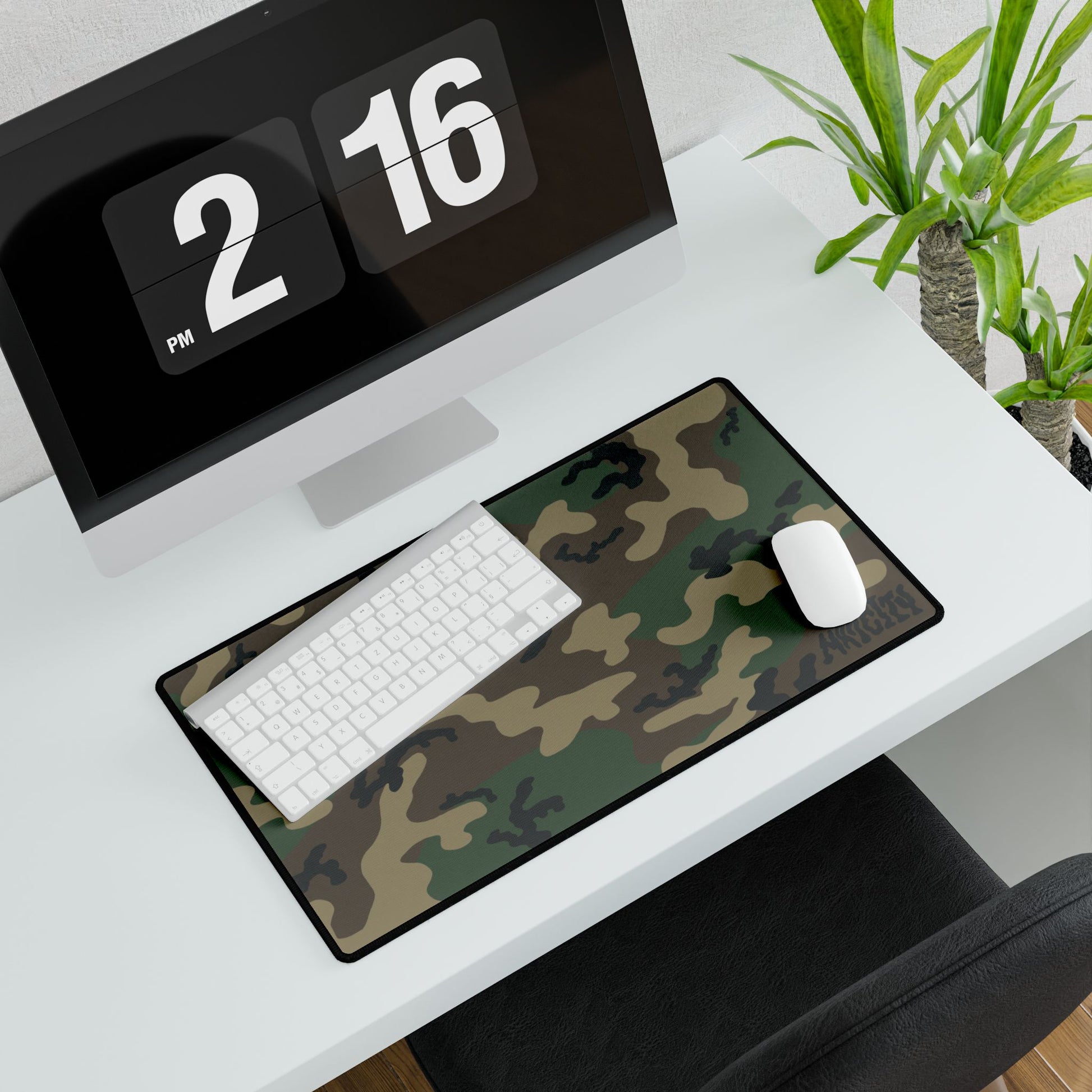 Woodland camouflage mouse pad on a desk with a computer, Keyboard and mouse.